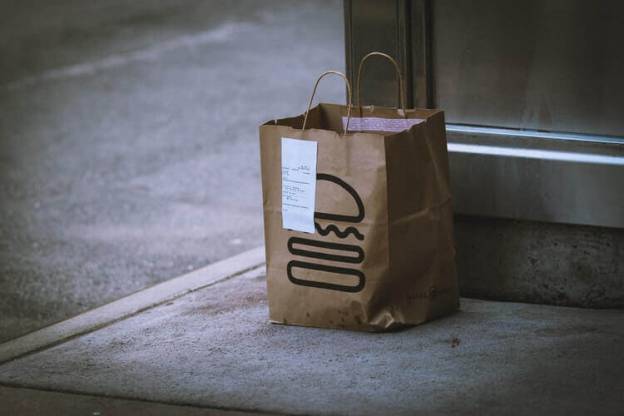 A food delivery bag with a drawing of a hamburger
