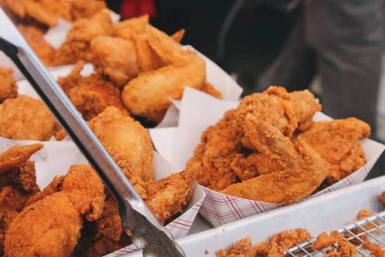 an image of boxes with fried chicken 