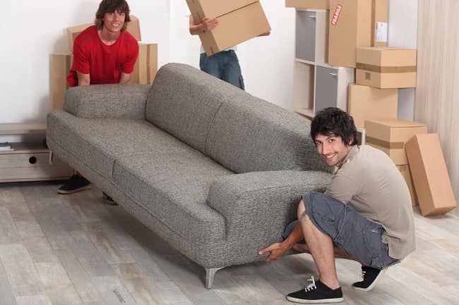 friends lifting a couch