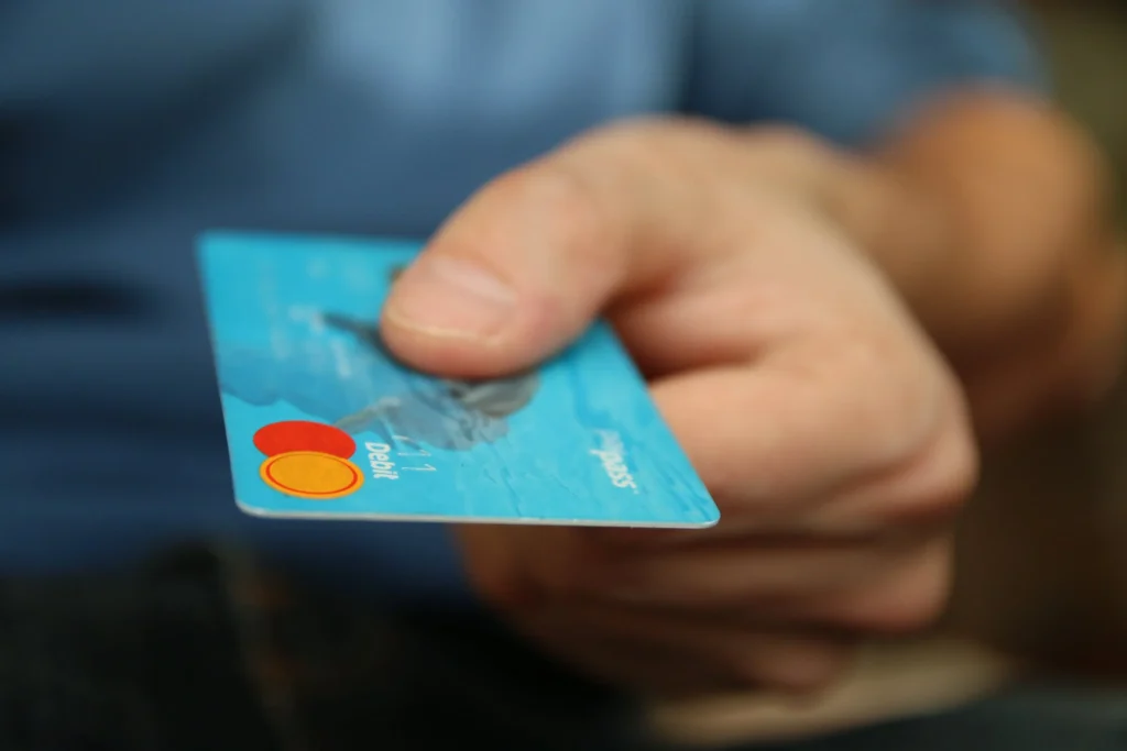 A man holding a credit card